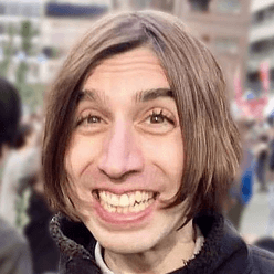 A picture of Bunpro user John, with their name, role and testimonial below